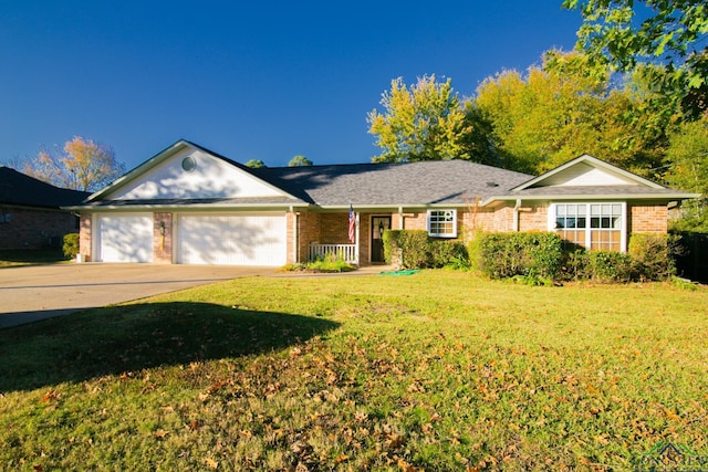 ranch-style home with a garage and a front yard