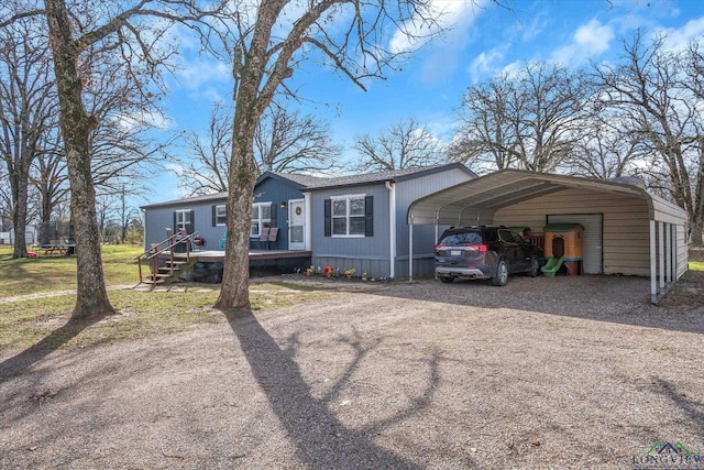 view of front of home featuring a front lawn and a carport