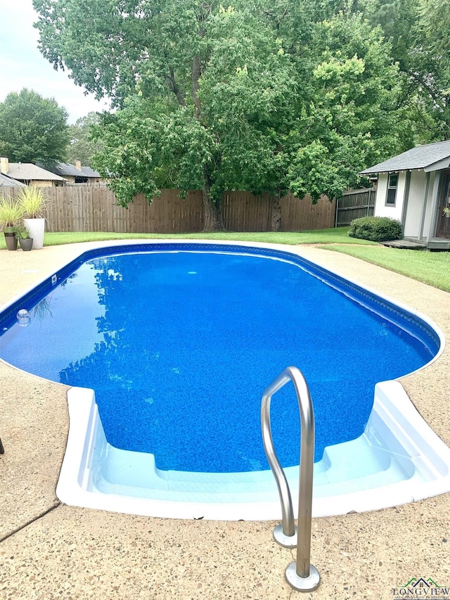4401 Leland St, Marshall, TX 75672 - view of pool with a fenced backyard and an outbuilding