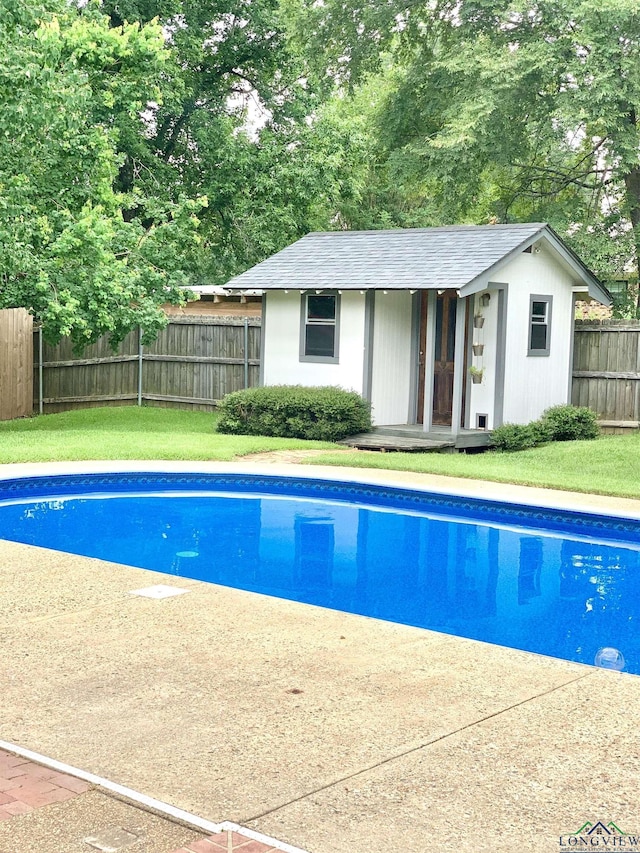 4401 Leland St, Marshall, TX 75672 - view of pool with an outbuilding, an exterior structure, and a fenced backyard