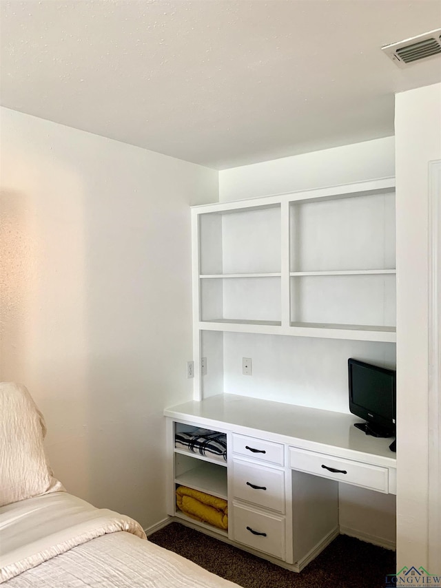 4401 Leland St, Marshall, TX 75672 - unfurnished bedroom featuring baseboards and built in study area