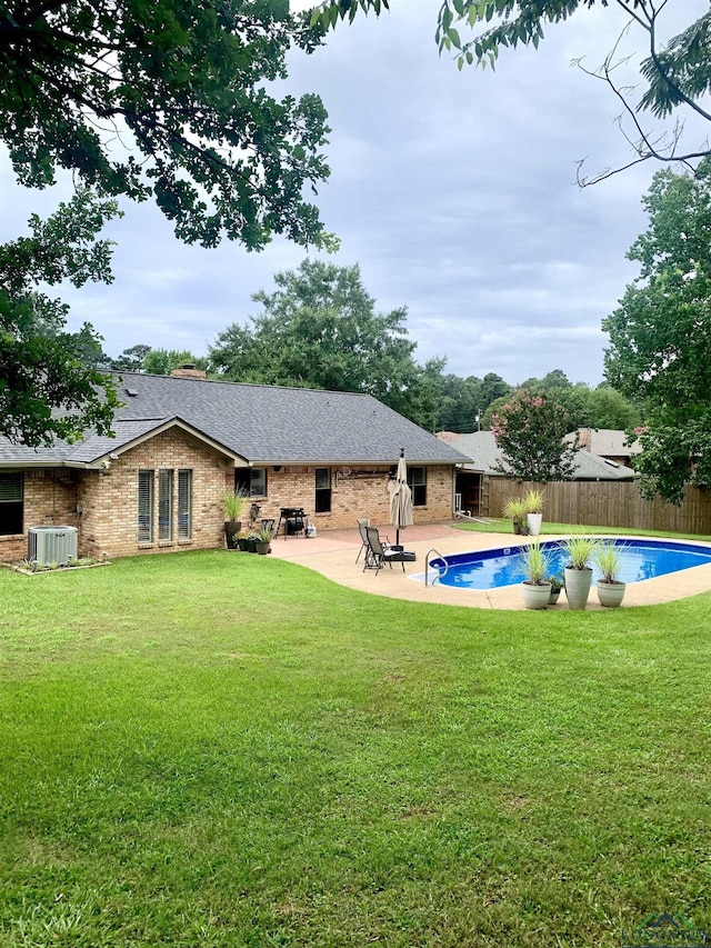 4401 Leland St, Marshall, TX 75672 - back of house featuring a fenced backyard, brick siding, a shingled roof, and a patio