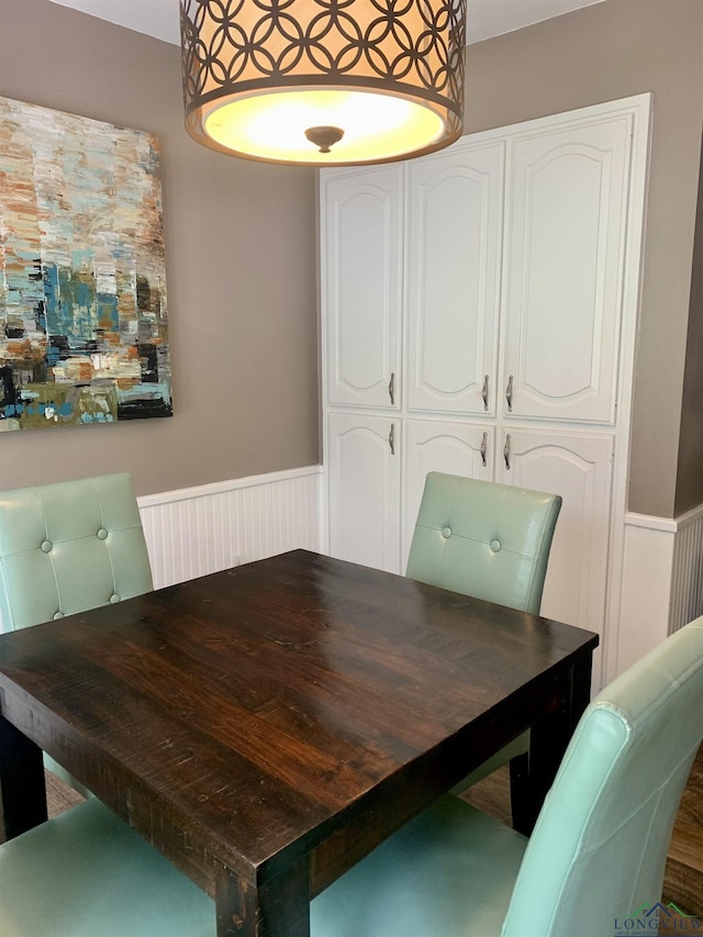 4401 Leland St, Marshall, TX 75672 - dining area with wainscoting and a decorative wall