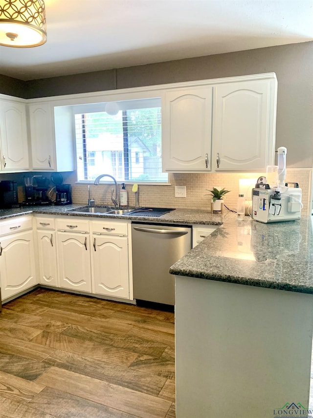 4401 Leland St, Marshall, TX 75672 - kitchen featuring dishwasher, backsplash, white cabinetry, and dark stone countertops