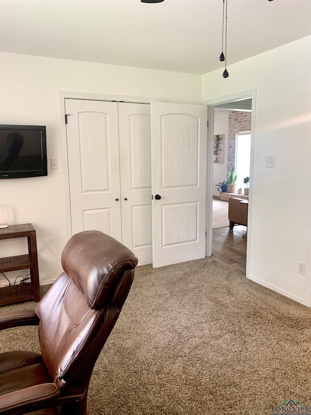 4401 Leland St, Marshall, TX 75672 - living area with carpet flooring and baseboards