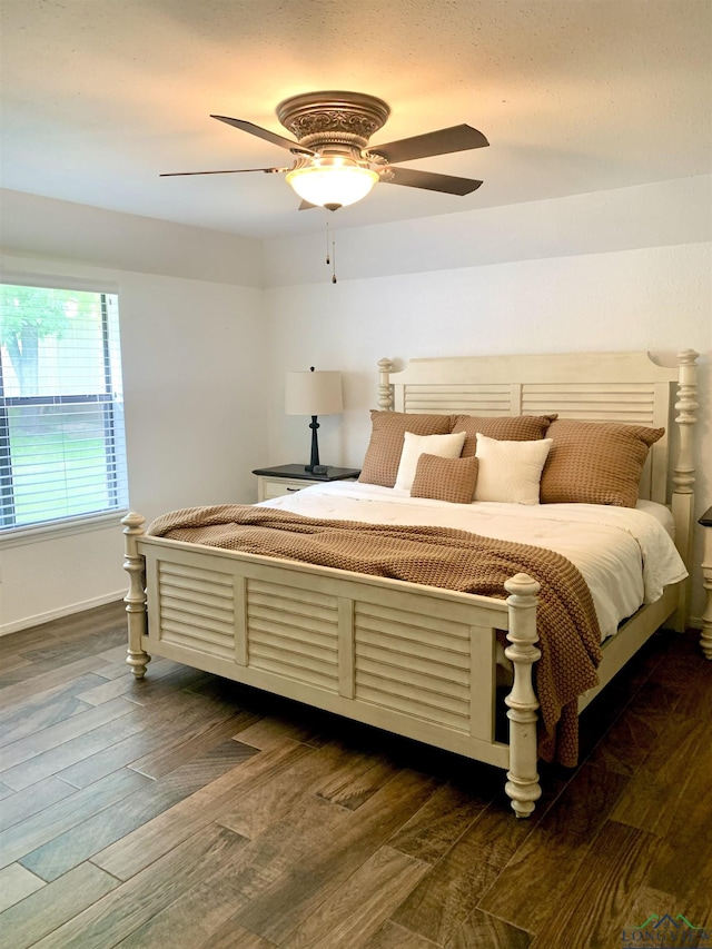4401 Leland St, Marshall, TX 75672 - bedroom with dark wood finished floors and ceiling fan