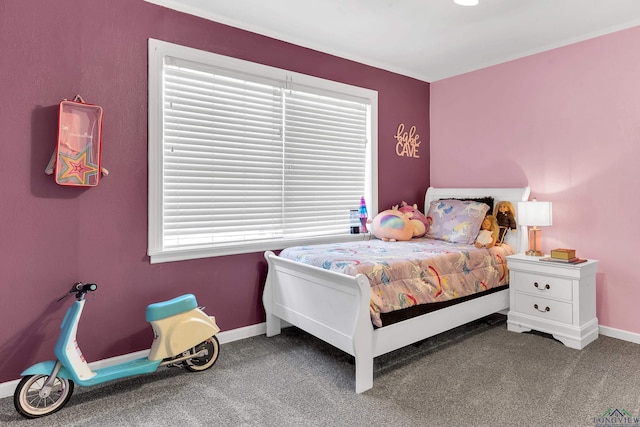 carpeted bedroom featuring baseboards