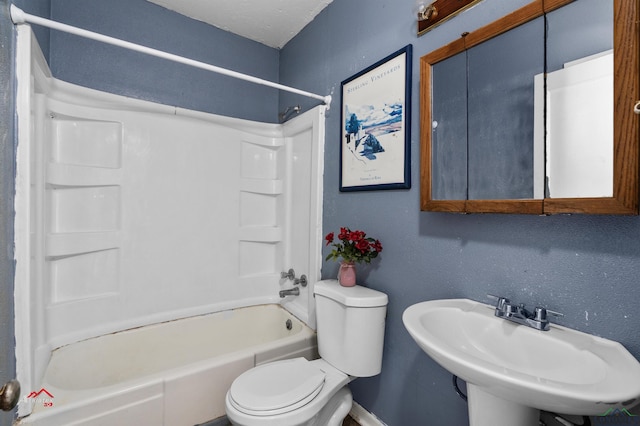 full bathroom with sink, tub / shower combination, and toilet