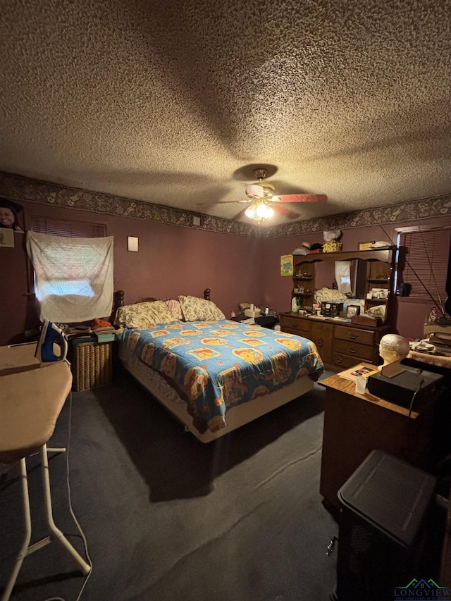 carpeted bedroom featuring ceiling fan and a textured ceiling