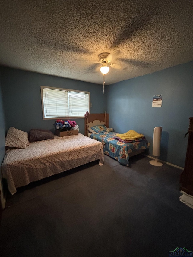 carpeted bedroom featuring a ceiling fan and a textured ceiling