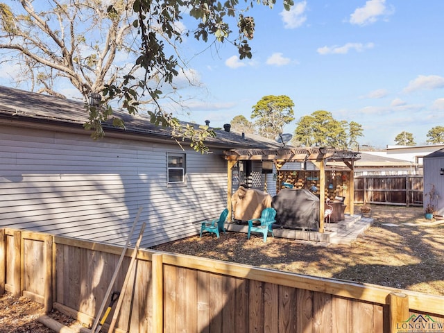 back of property featuring a pergola