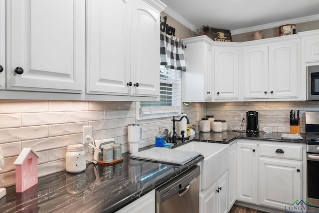 kitchen with ornamental molding, stainless steel appliances, decorative backsplash, and white cabinets