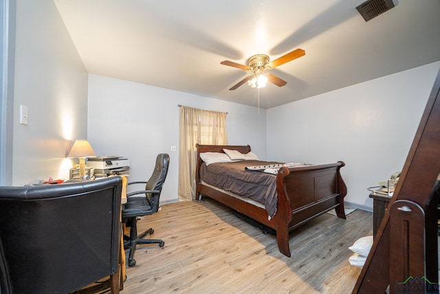 bedroom with light wood-type flooring and ceiling fan