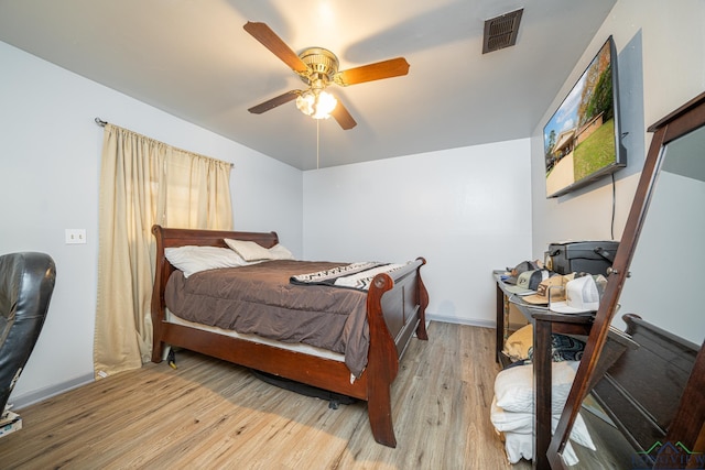 bedroom featuring light hardwood / wood-style flooring and ceiling fan