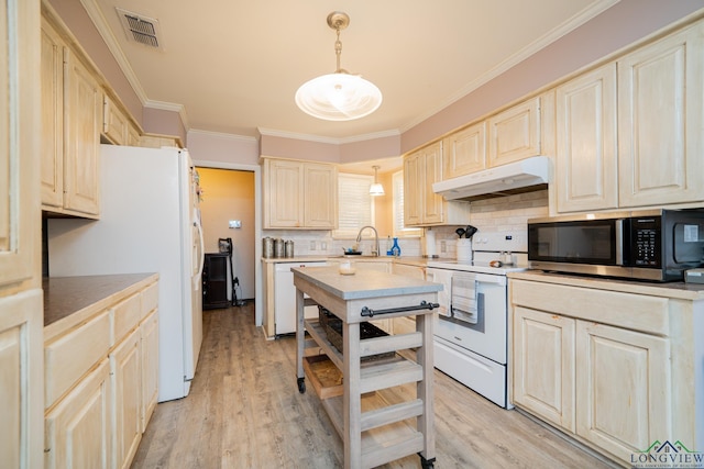 kitchen featuring pendant lighting, white appliances, sink, tasteful backsplash, and light hardwood / wood-style floors