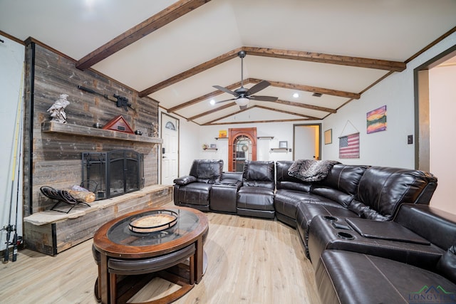 living room with light wood-type flooring, a large fireplace, ceiling fan, wooden walls, and lofted ceiling with beams