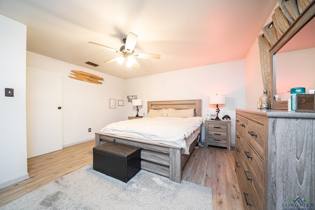 bedroom featuring light hardwood / wood-style floors and ceiling fan