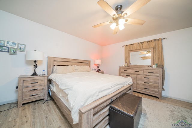 bedroom featuring light wood-type flooring and ceiling fan