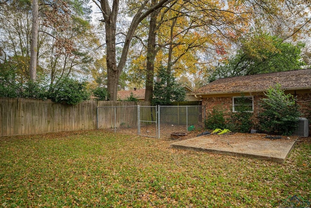 view of yard with central AC