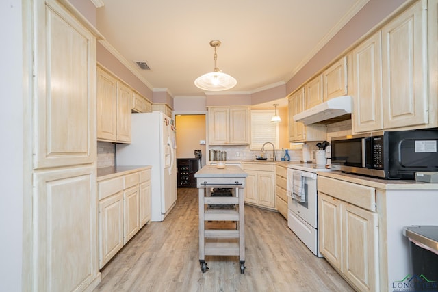 kitchen with decorative backsplash, a kitchen island, white appliances, and hanging light fixtures