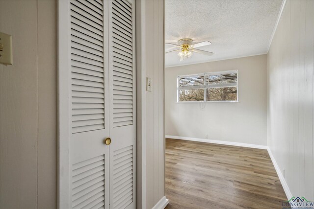 1480 Woodland Dr, Canton, TX 75103 - unfurnished bedroom featuring crown molding, a closet, a textured ceiling, and light wood-type flooring
