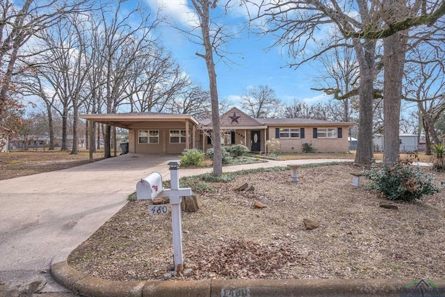 ranch-style home with a carport