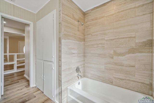 1480 Woodland Dr, Canton, TX 75103 - bathroom featuring hardwood / wood-style flooring and tiled shower / bath