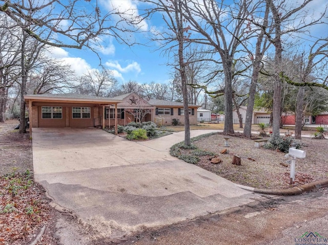 ranch-style house featuring a carport