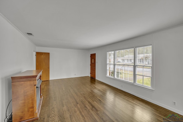 unfurnished living room with dark hardwood / wood-style floors