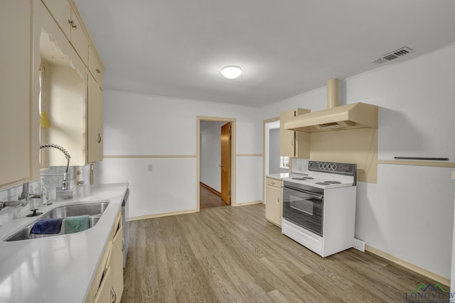 kitchen with sink, white electric range, premium range hood, cream cabinetry, and light wood-type flooring