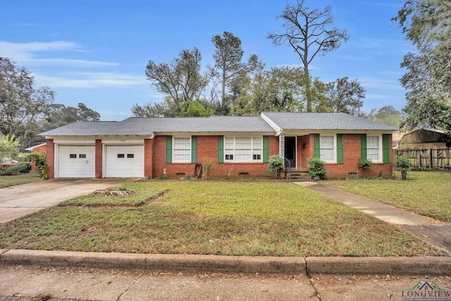 single story home with a garage and a front yard