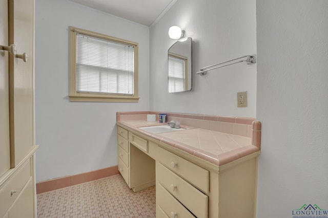 bathroom with vanity and crown molding