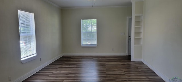 unfurnished room featuring crown molding and dark wood-type flooring