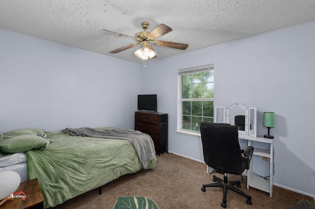 carpeted bedroom featuring a textured ceiling and ceiling fan