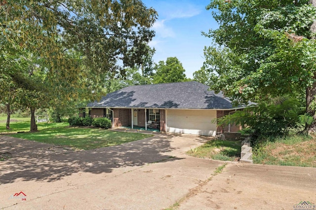 view of front of home featuring a garage and a front yard