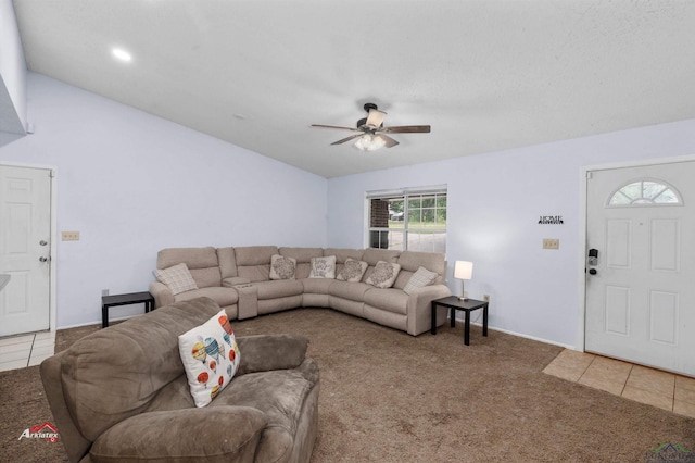 living room featuring tile patterned flooring and ceiling fan