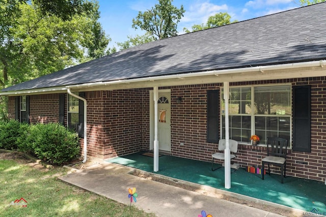 doorway to property featuring covered porch