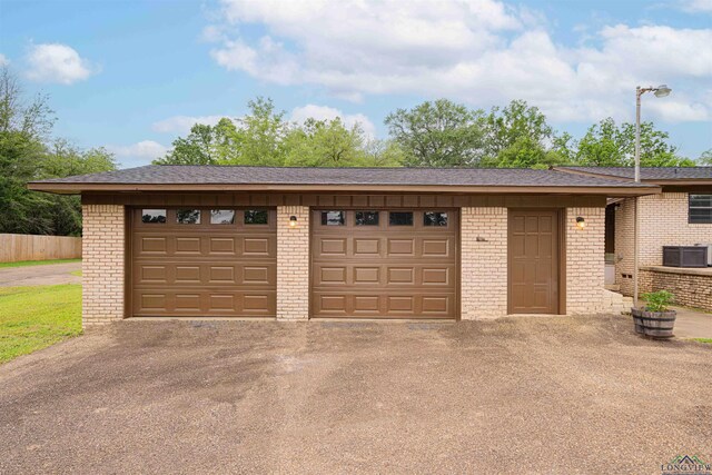 502 Hillcrest, Hughes Springs, TX 75656 - garage with aphalt driveway