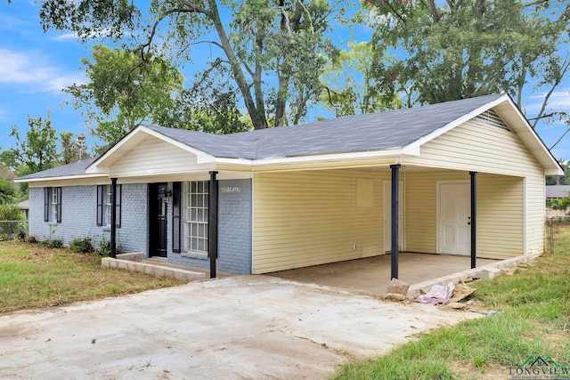 ranch-style house with a carport