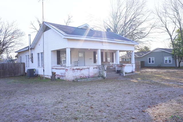 view of front facade with a porch and cooling unit