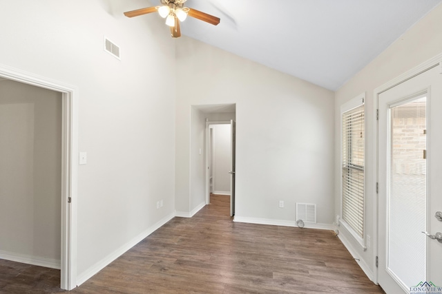 unfurnished bedroom with dark wood-type flooring, baseboards, visible vents, and high vaulted ceiling