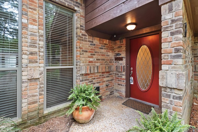 property entrance with brick siding