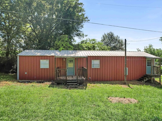 306 W Gilmer, Big Sandy, TX 75765 - view of front of property featuring a front lawn and a metal roof