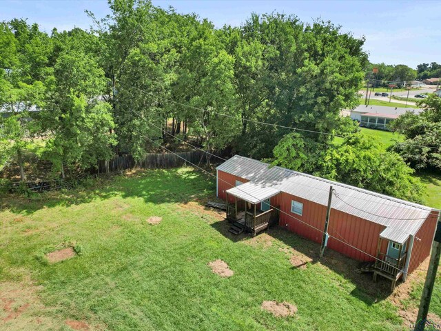 306 W Gilmer, Big Sandy, TX 75765 - view of grassy yard with an outbuilding