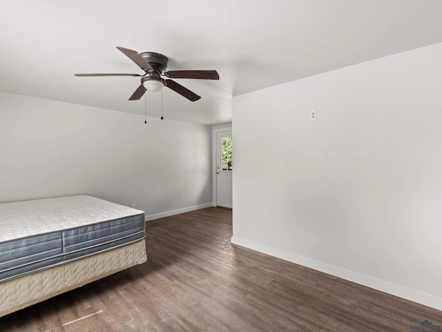 306 W Gilmer, Big Sandy, TX 75765 - unfurnished bedroom featuring wood finished floors and ceiling fan