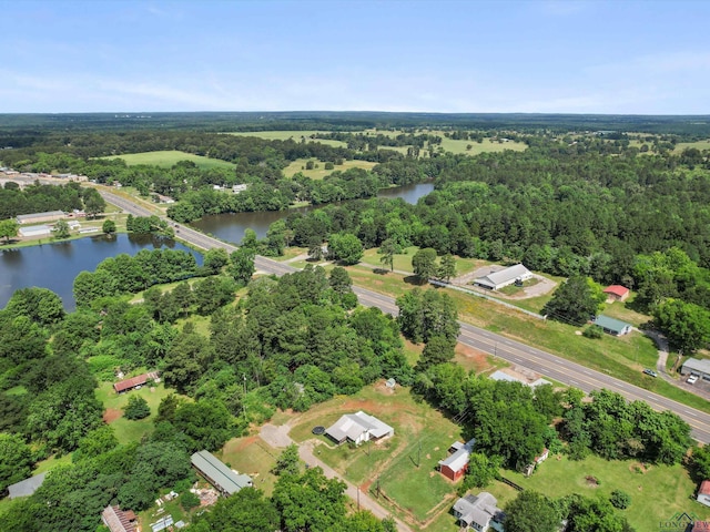 306 W Gilmer, Big Sandy, TX 75765 - aerial view of property and surrounding area featuring a nearby body of water and a forest