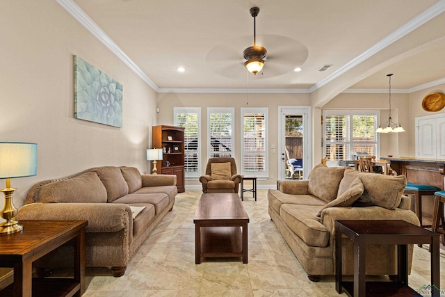 living room with crown molding and ceiling fan with notable chandelier