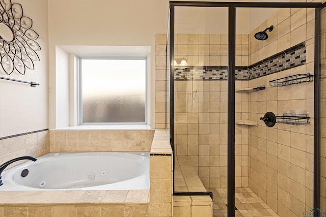 bathroom featuring shower with separate bathtub