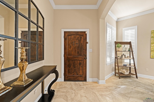 foyer featuring crown molding