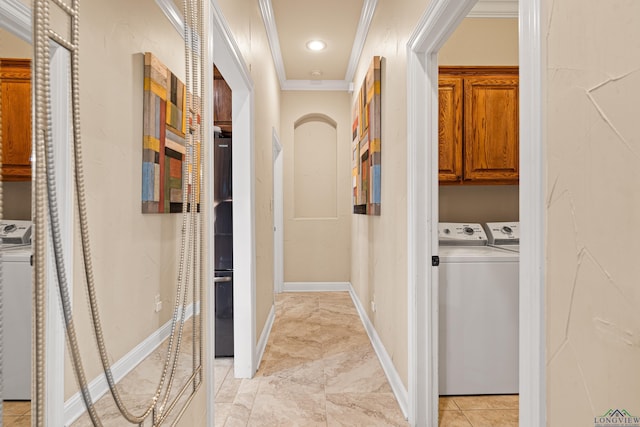 hallway featuring crown molding and washer and dryer